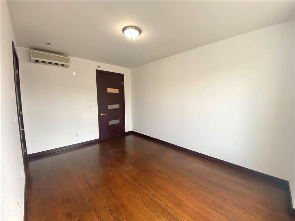 2409 Avenue Z, Unit 202 Brooklyn, NY 11235 - Photo 11 of 26 a view of an empty room with wooden floor and closet