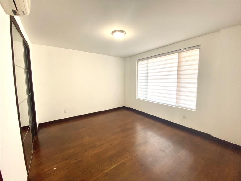 2409 Avenue Z, Unit 202 Brooklyn, NY 11235 - Photo 13 of 26 a view of an empty room with a window