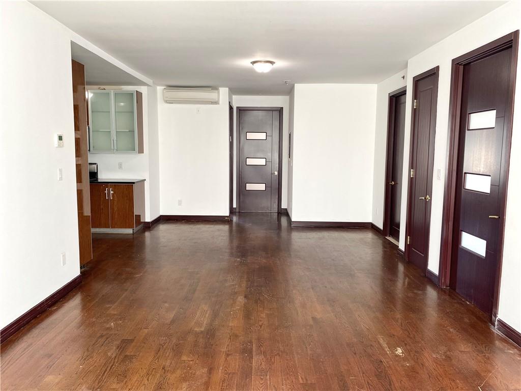 2409 Avenue Z, Unit 202 Brooklyn, NY 11235 - Photo 5 of 26 wooden floor in an empty room with a window