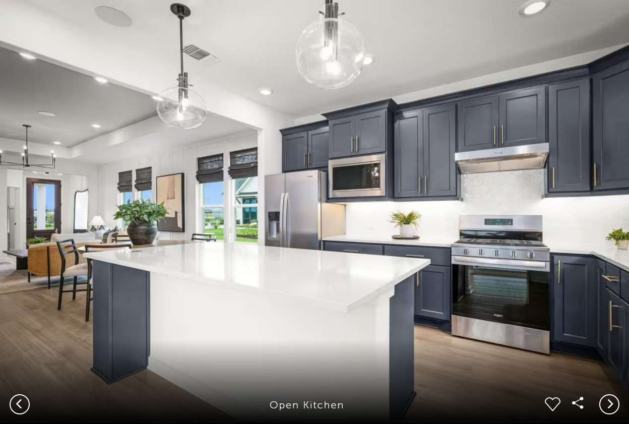 1002 Martingale Street Georgetown, TX 78633 - Photo 15 of 15 a large kitchen with kitchen island a large island in it