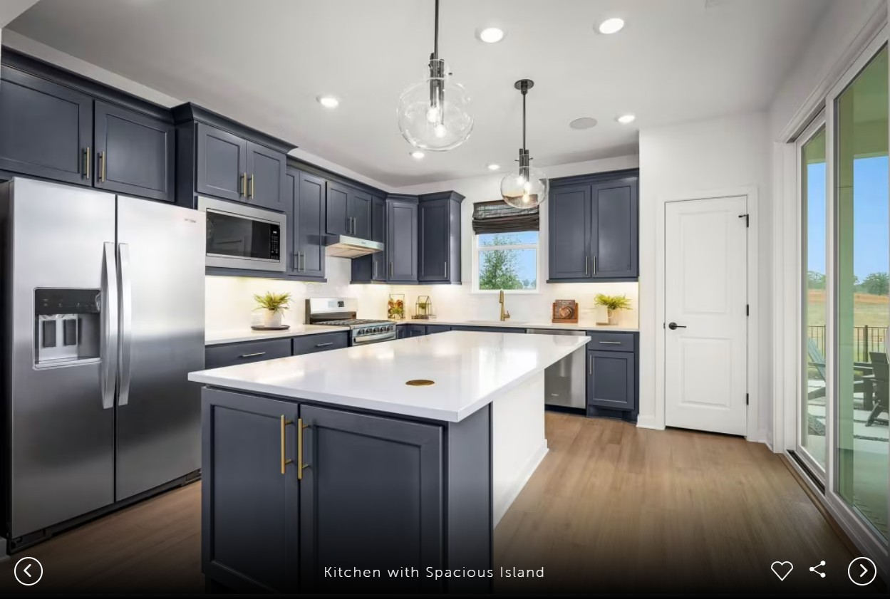 1002 Martingale Street Georgetown, TX 78633 - Photo 5 of 15 a kitchen with stainless steel appliances granite countertop a sink a stove a refrigerator and a oven with wooden floor