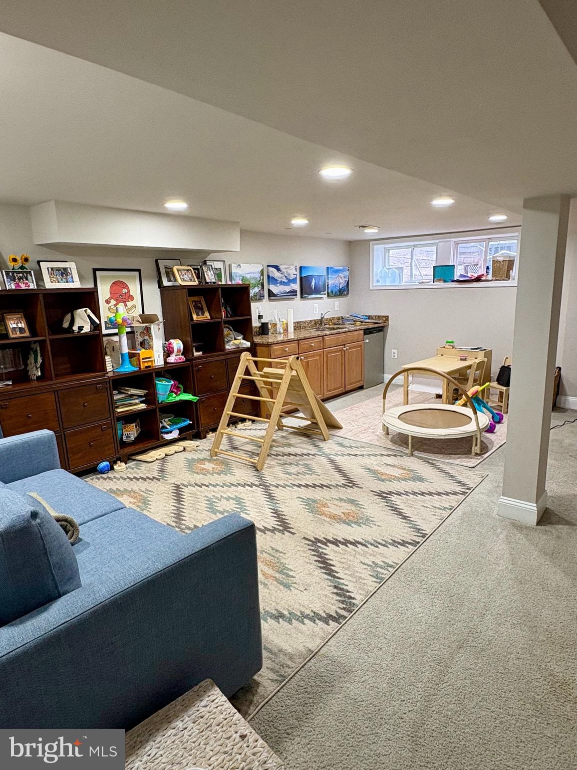 1011 8th Street Northeast Washington, DC 20002 - Photo 32 of 34 a living room with furniture gym equipment and a large window