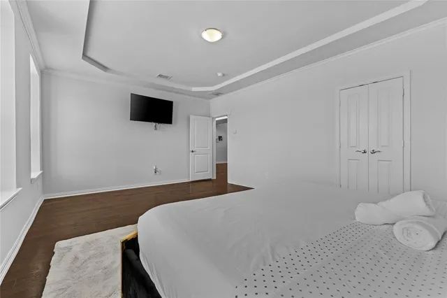 a bedroom with a bed and a view of bathroom