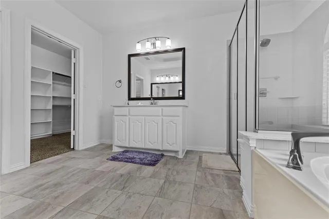 a view of a bathroom with sink and mirror