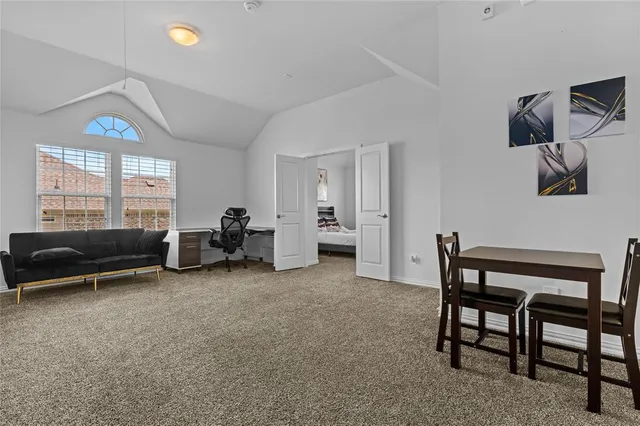 a view of a livingroom with furniture and windows
