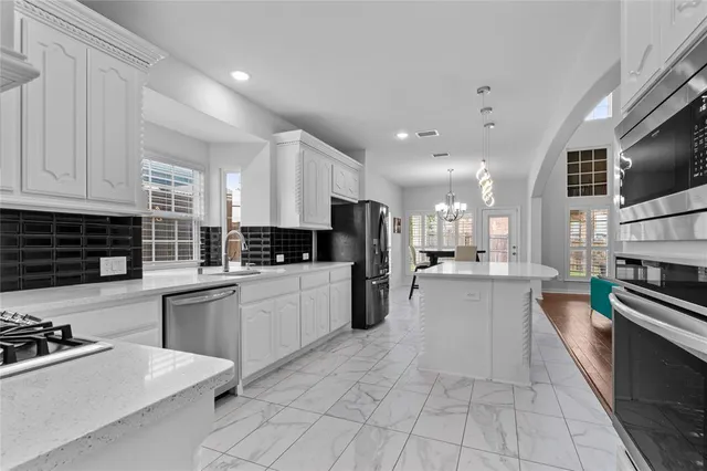 a large kitchen with cabinets