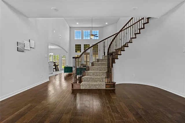 a view of entryway and hall with wooden floor