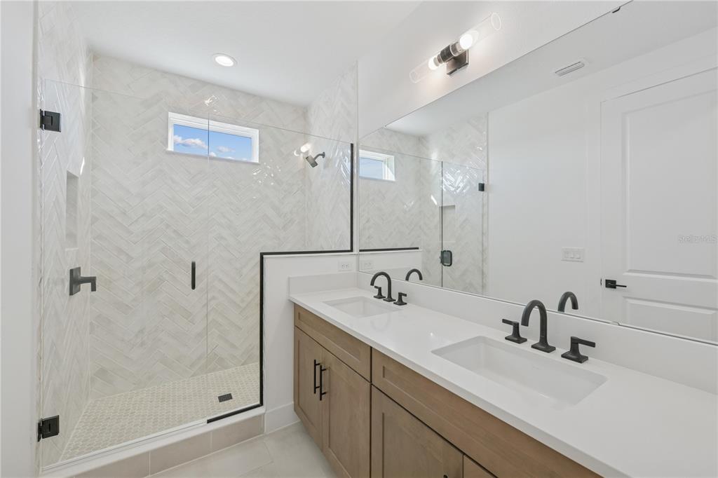 2224 Brix Street Orlando, FL 32804 - Photo 11 of 36 a bathroom with a sink and a mirror