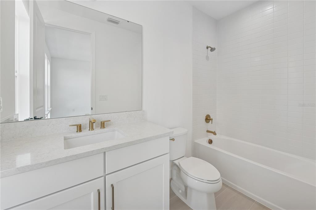 2224 Brix Street Orlando, FL 32804 - Photo 15 of 36 a bathroom with a sink toilet vanity and tub