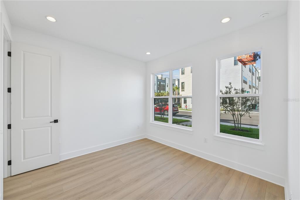 2224 Brix Street Orlando, FL 32804 - Photo 4 of 36 a view of an empty room with wooden floor and a window