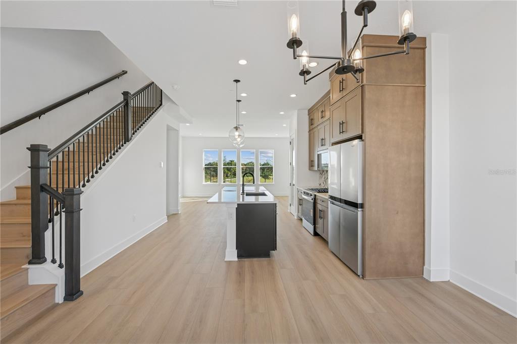 2224 Brix Street Orlando, FL 32804 - Photo 6 of 36 a kitchen with stainless steel appliances a refrigerator and wooden floor