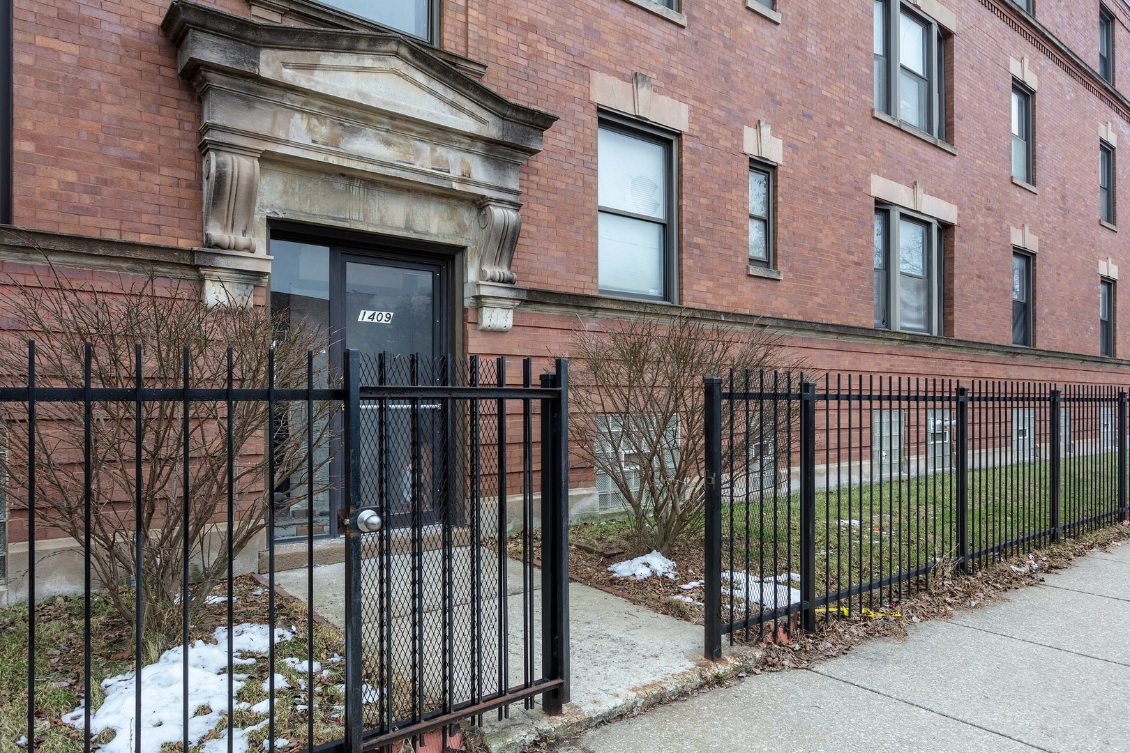 1409 East 62nd Street, Unit 3 Chicago, IL 60637 - Photo 1 of 10 a view of a brick building from a balcony