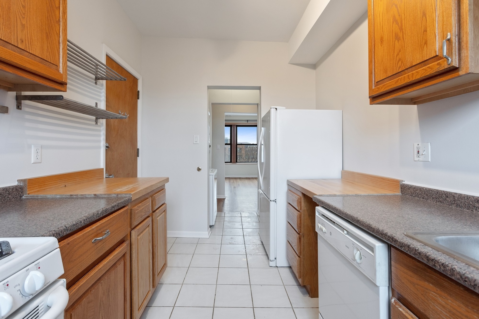 1409 East 62nd Street, Unit 3 Chicago, IL 60637 - Photo 6 of 10 a kitchen with a sink and cabinets