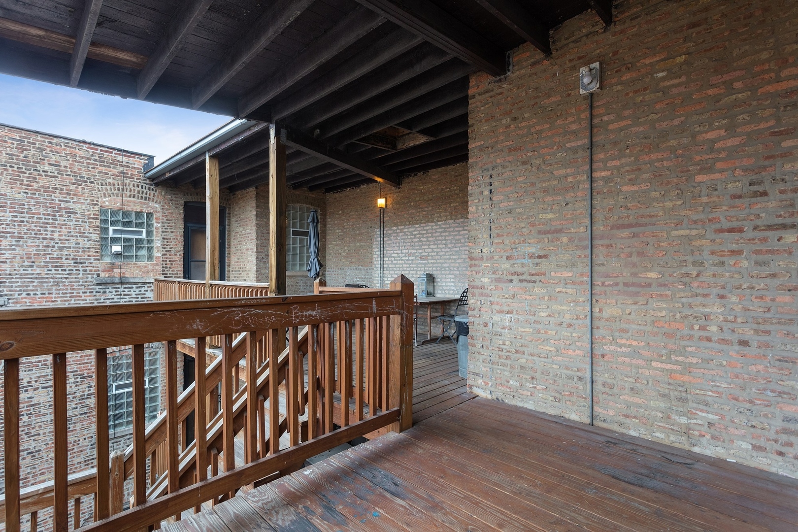1409 East 62nd Street, Unit 3 Chicago, IL 60637 - Photo 10 of 10 a view of wooden balcony