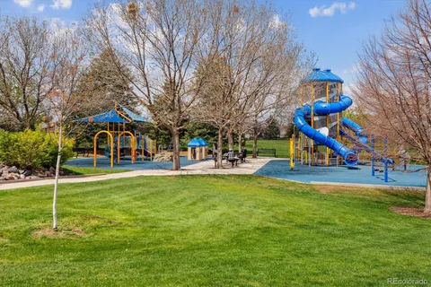 a view of a park with large trees