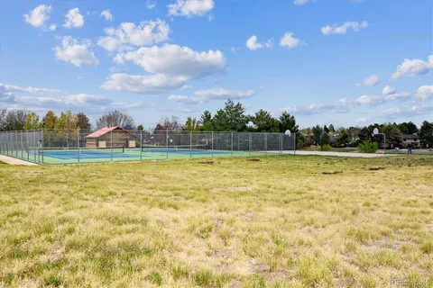 a view of a swimming pool and a yard