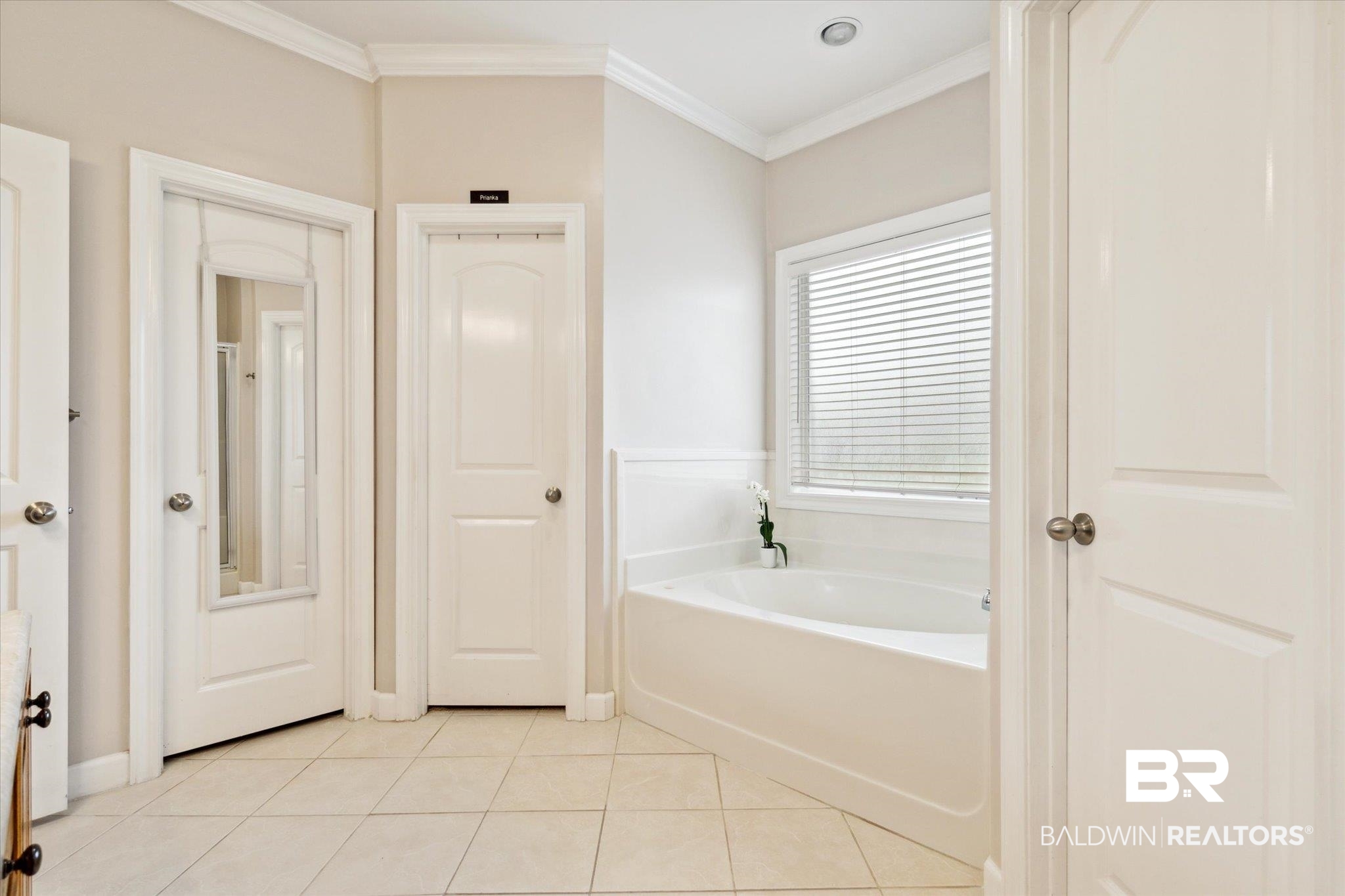 1561 William Dunn Way Mobile, AL 36695 - Photo 13 of 28 Bathroom with tile patterned flooring, a bath, and crown molding
