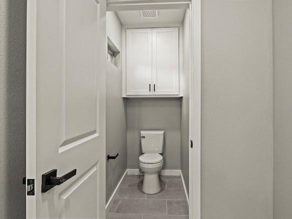 1301 East 9th Street Mount Pleasant, TX 75455 - Photo 11 of 26 a bathroom with a toilet