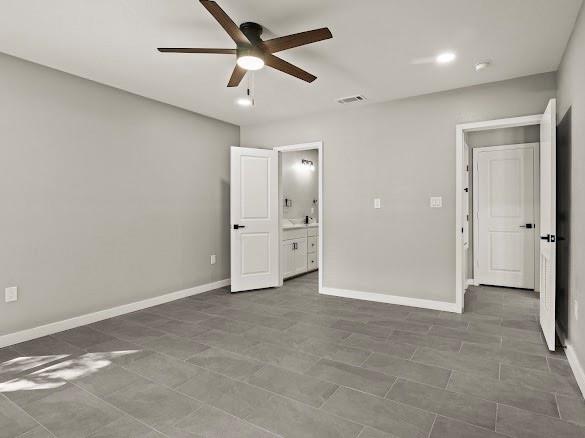 1301 East 9th Street Mount Pleasant, TX 75455 - Photo 13 of 26 an empty room with fan and a ceiling fan