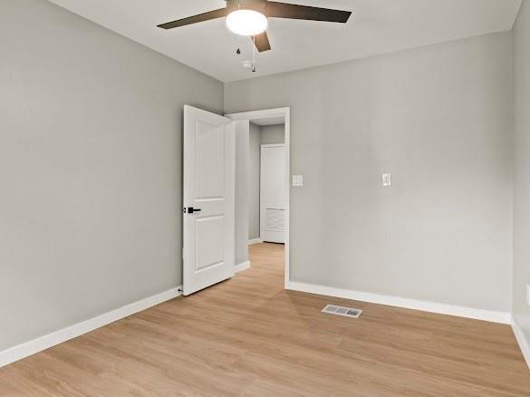 1301 East 9th Street Mount Pleasant, TX 75455 - Photo 23 of 26 wooden floor in an empty room