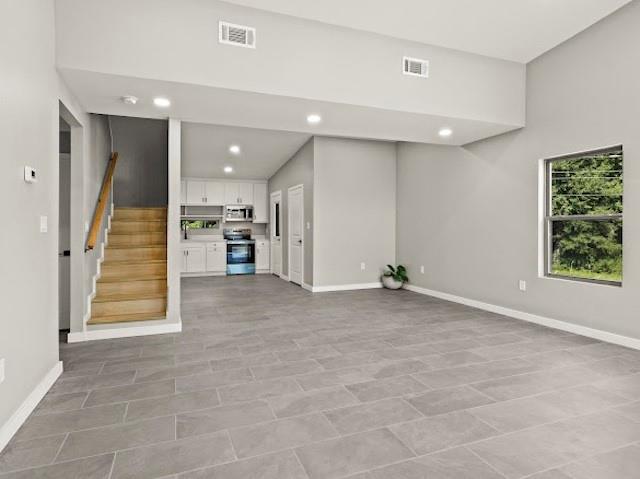 1301 East 9th Street Mount Pleasant, TX 75455 - Photo 3 of 26 a view of a livingroom with a staircase