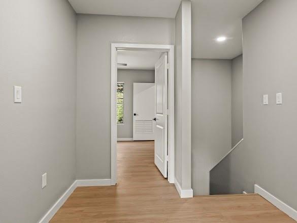 1301 East 9th Street Mount Pleasant, TX 75455 - Photo 7 of 26 a view of a hallway with wooden floor
