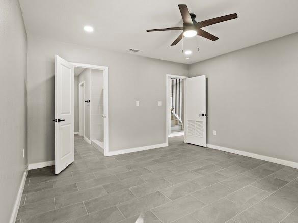 1301 East 9th Street Mount Pleasant, TX 75455 - Photo 8 of 26 an empty room with closet and a ceiling fan