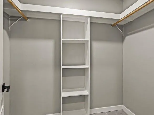 a view of an empty walk in closet