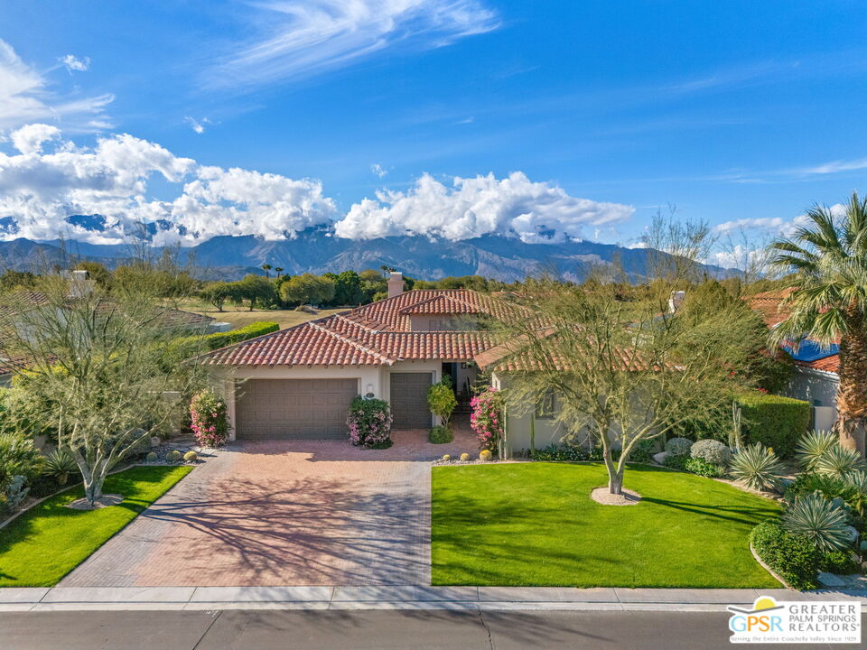 182 Loch Lomond Road Rancho Mirage, CA 92270 - Photo 13 of 48 a front view of a house with a yard