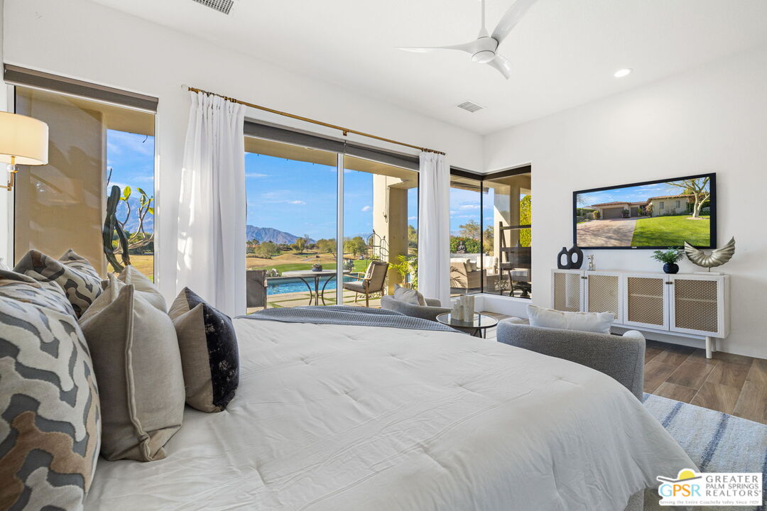182 Loch Lomond Road Rancho Mirage, CA 92270 - Photo 27 of 48 a bedroom with a bed and large window