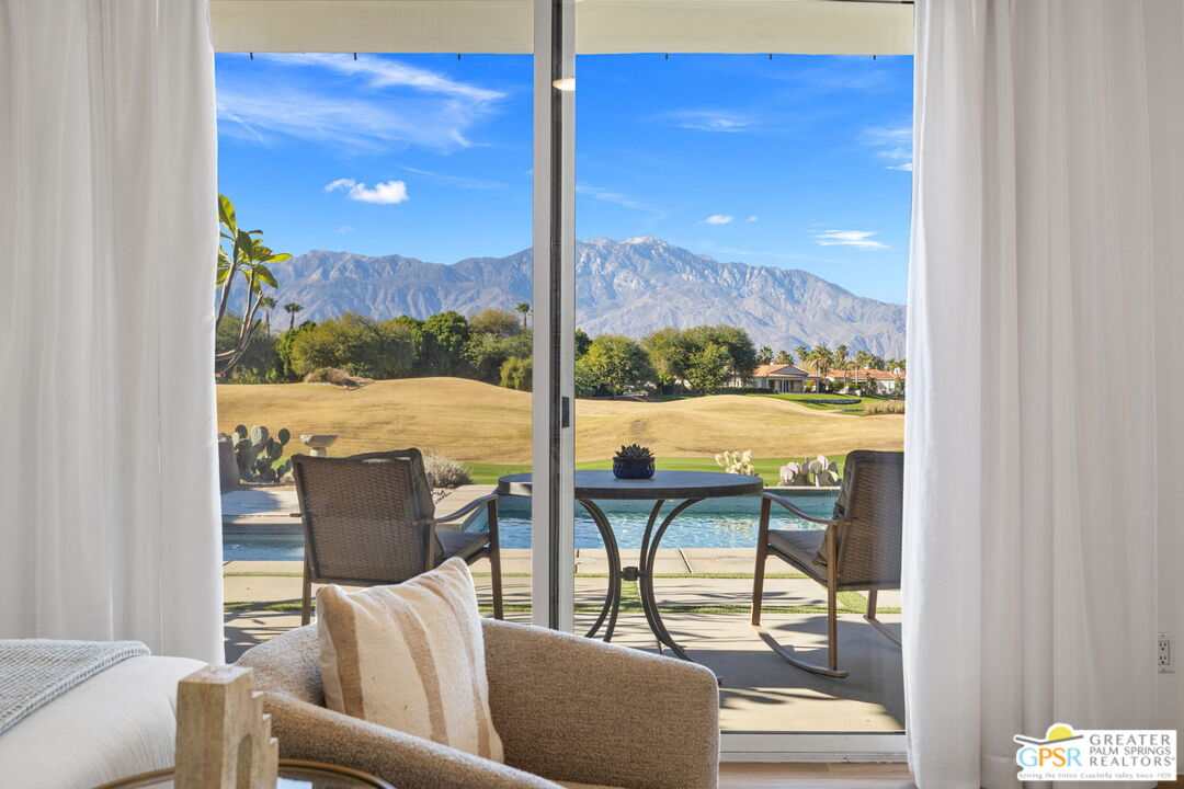 182 Loch Lomond Road Rancho Mirage, CA 92270 - Photo 28 of 48 a view of balcony with two chairs and a table