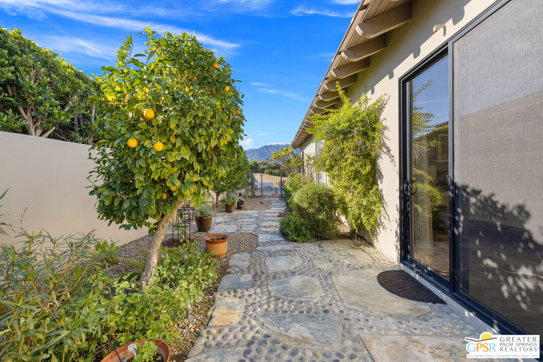 182 Loch Lomond Road Rancho Mirage, CA 92270 - Photo 31 of 48 a backyard of a house with lots of green space