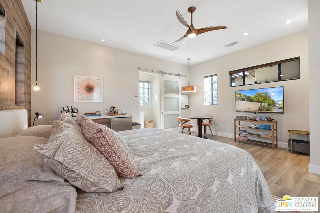 182 Loch Lomond Road Rancho Mirage, CA 92270 - Photo 39 of 48 a large bedroom with a bed and a flat screen tv