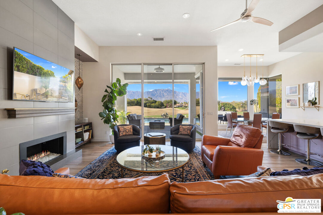 182 Loch Lomond Road Rancho Mirage, CA 92270 - Photo 5 of 48 a living room with furniture and a fireplace