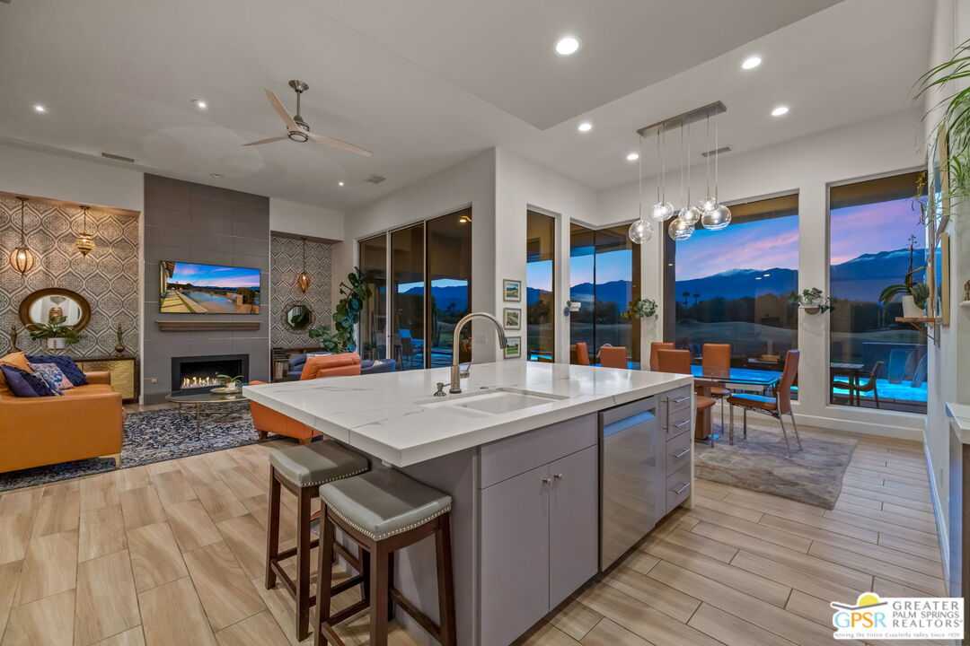 182 Loch Lomond Road Rancho Mirage, CA 92270 - Photo 7 of 48 a large kitchen with a table and chairs