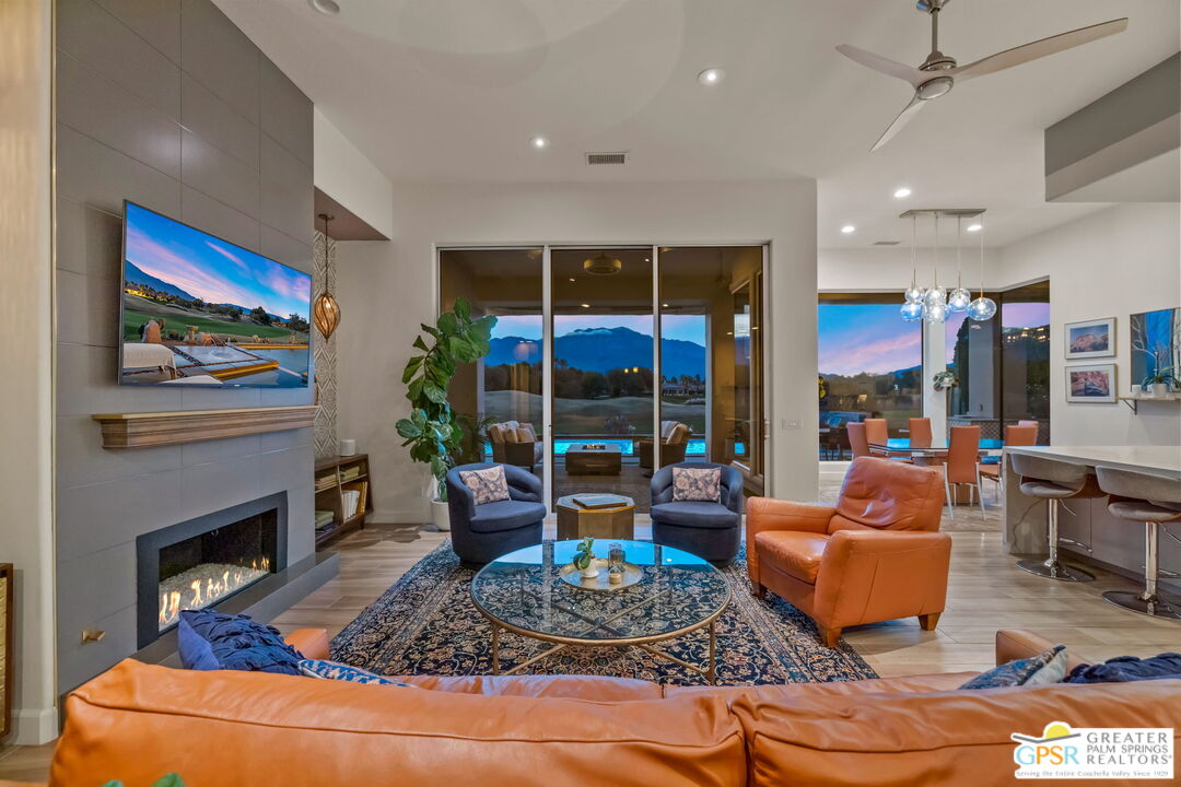 182 Loch Lomond Road Rancho Mirage, CA 92270 - Photo 9 of 48 a living room with fireplace furniture and a fireplace