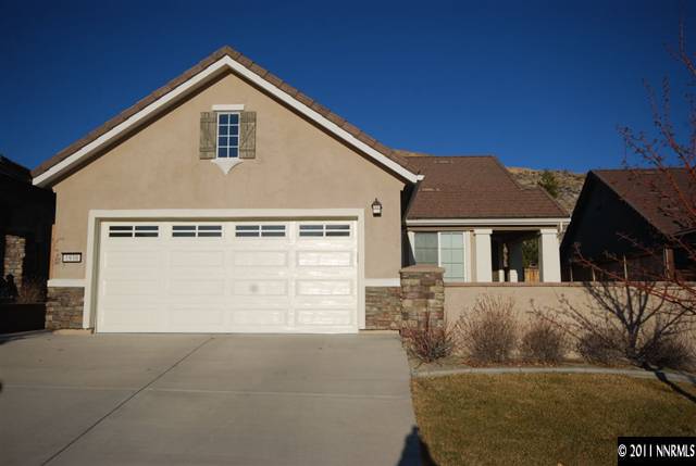 1930 Evergreen Ridge Way Reno, NV 89523 - Photo 1 of 13 a front view of a house with a yard