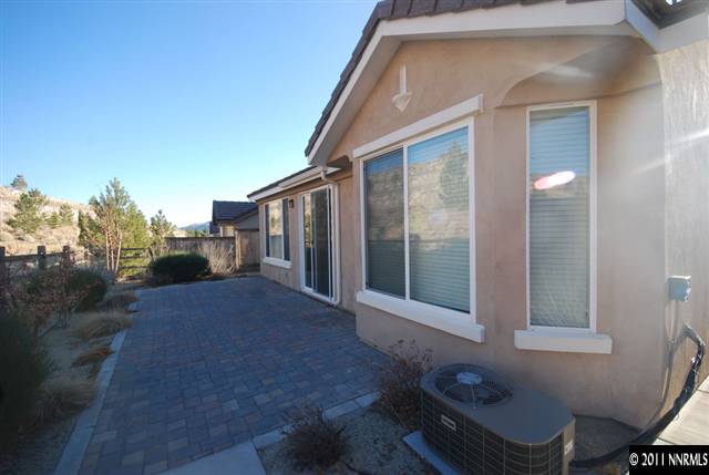 1930 Evergreen Ridge Way Reno, NV 89523 - Photo 12 of 13 a backyard of a house with table and chairs