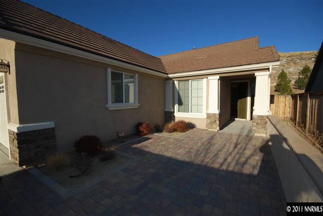 1930 Evergreen Ridge Way Reno, NV 89523 - Photo 13 of 13 a backyard of a house with table and chairs