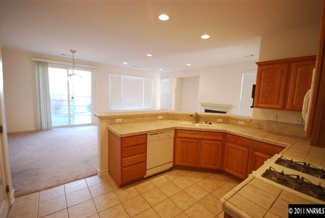 1930 Evergreen Ridge Way Reno, NV 89523 - Photo 4 of 13 a kitchen with a sink window and cabinets
