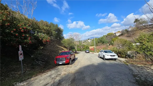a view of a car parked on the side of a road