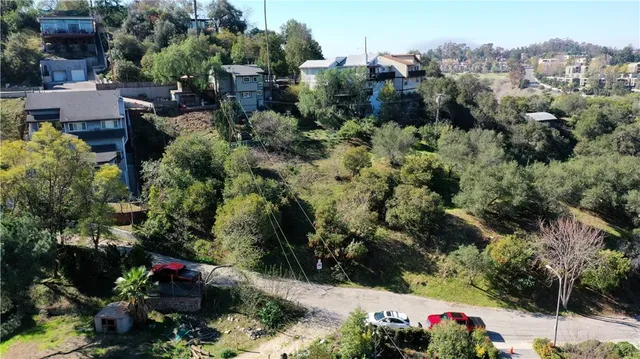 an aerial view of a house with a yard