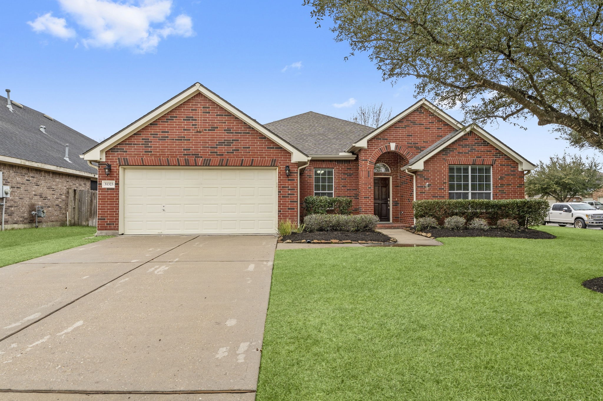a front view of house with yard and green space