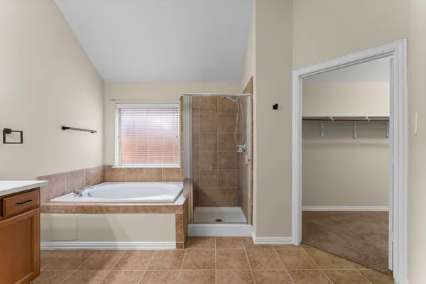 a view of a house with a yard balcony and outdoor seating