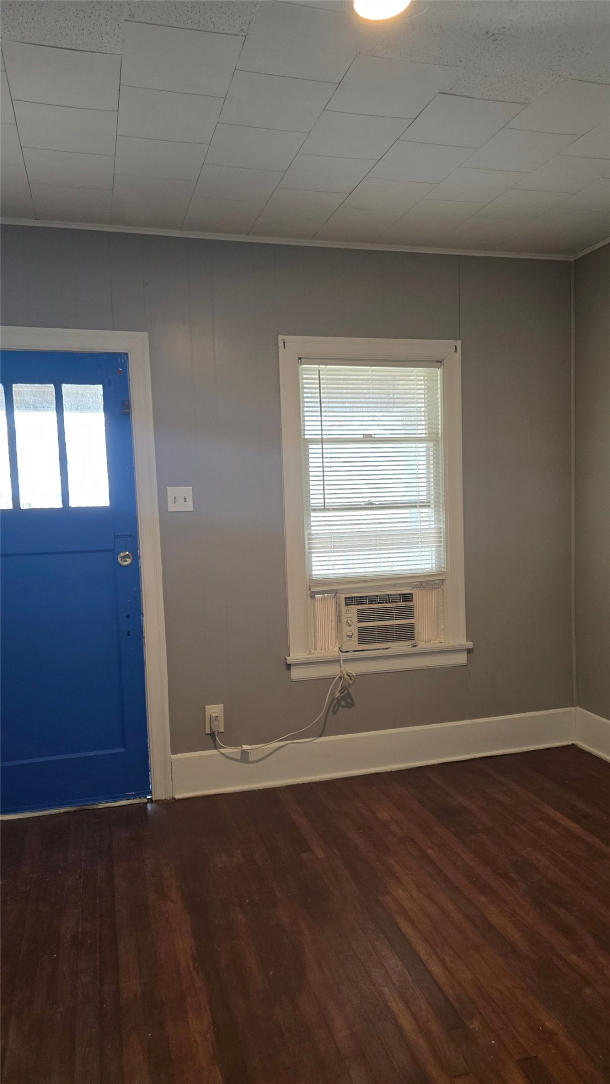 18327 Blake Manor Road, Unit A Manor, TX 78653 - Photo 11 of 21 Entryway featuring healthy amount of natural light, dark wood-style flooring, and cooling unit