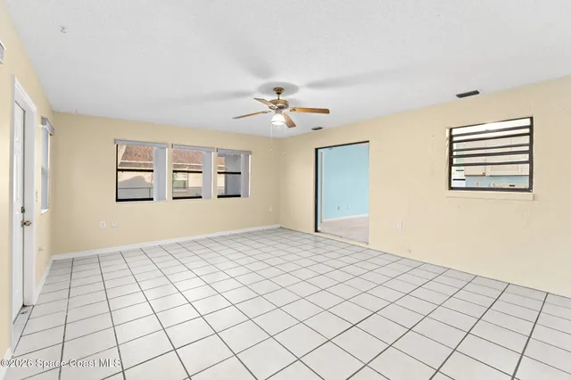 a view of an empty room and window