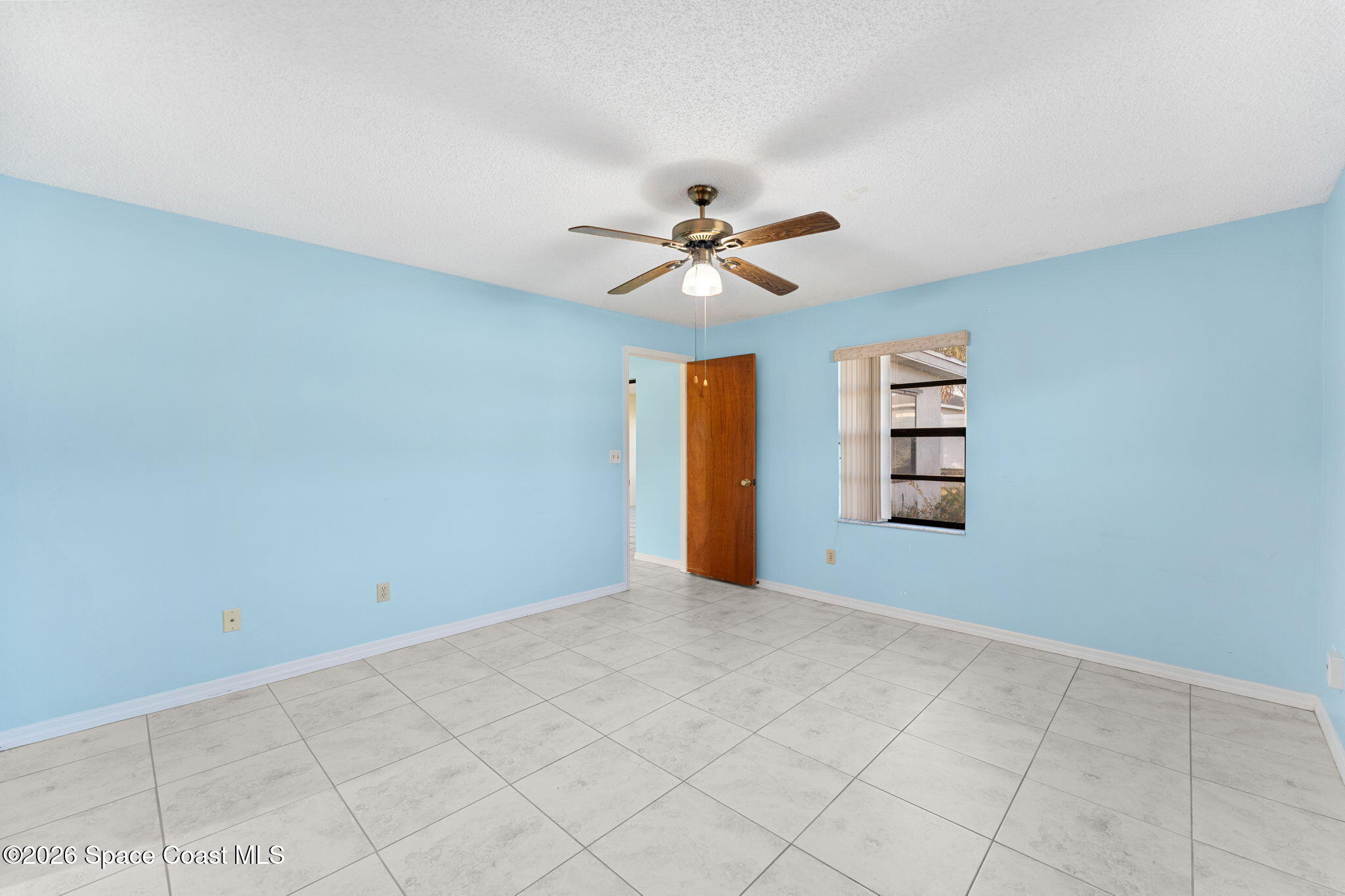 960 Pineland Drive Rockledge, FL 32955 - Photo 15 of 32 a view of an empty room with a window