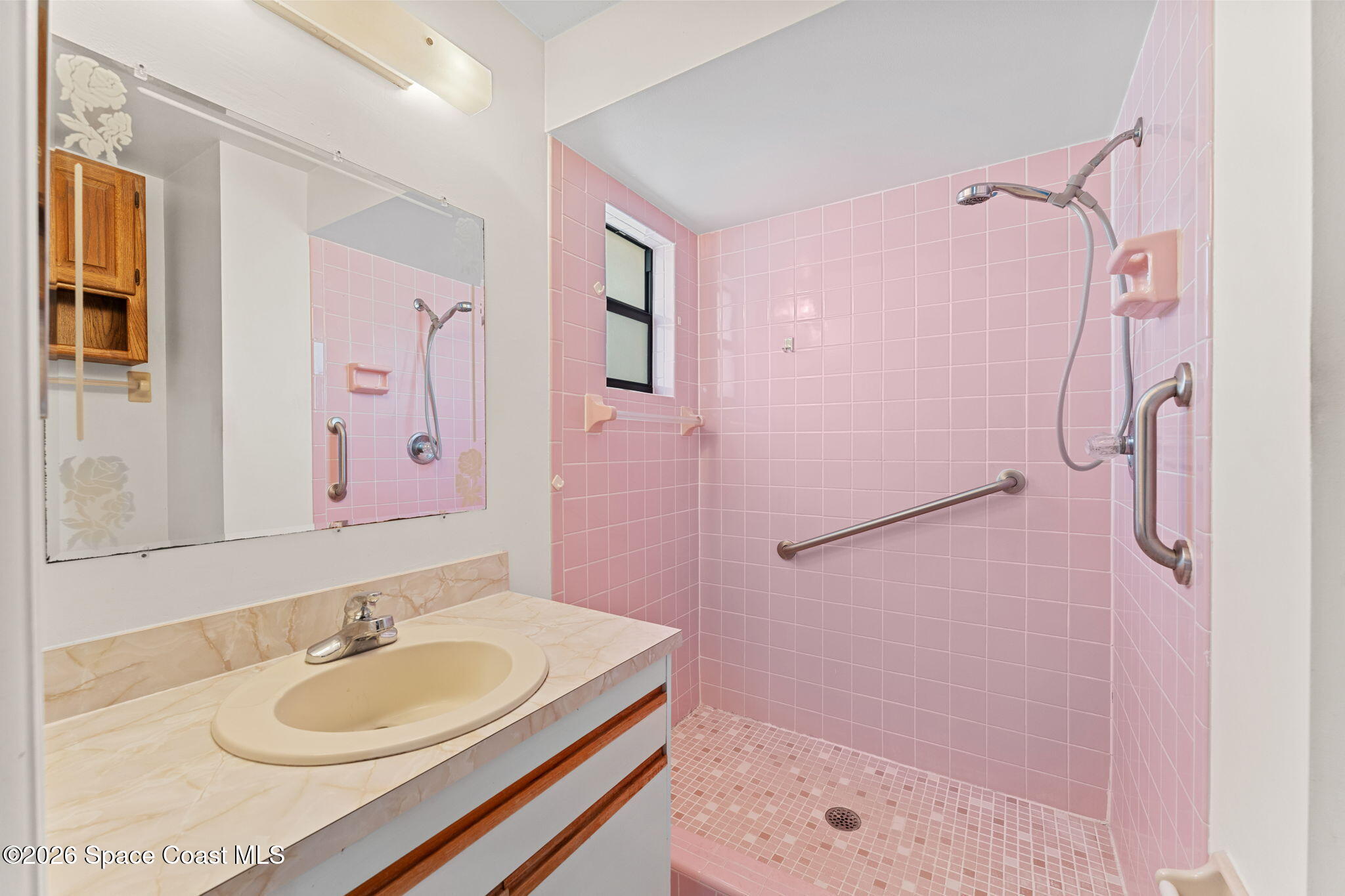 960 Pineland Drive Rockledge, FL 32955 - Photo 17 of 32 a bathroom with a sink tub shower and a mirror