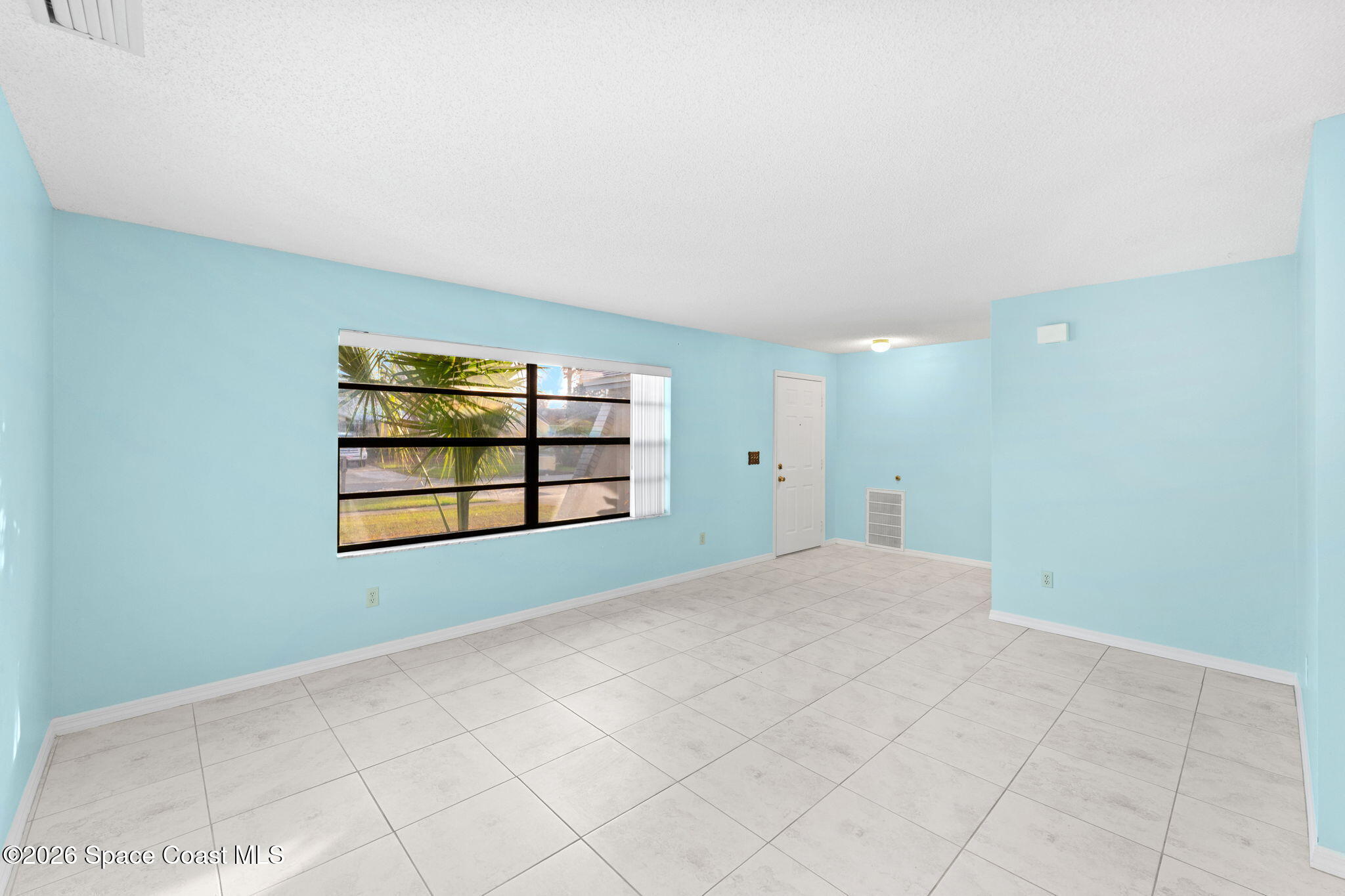 960 Pineland Drive Rockledge, FL 32955 - Photo 2 of 32 a view of an empty room with a window