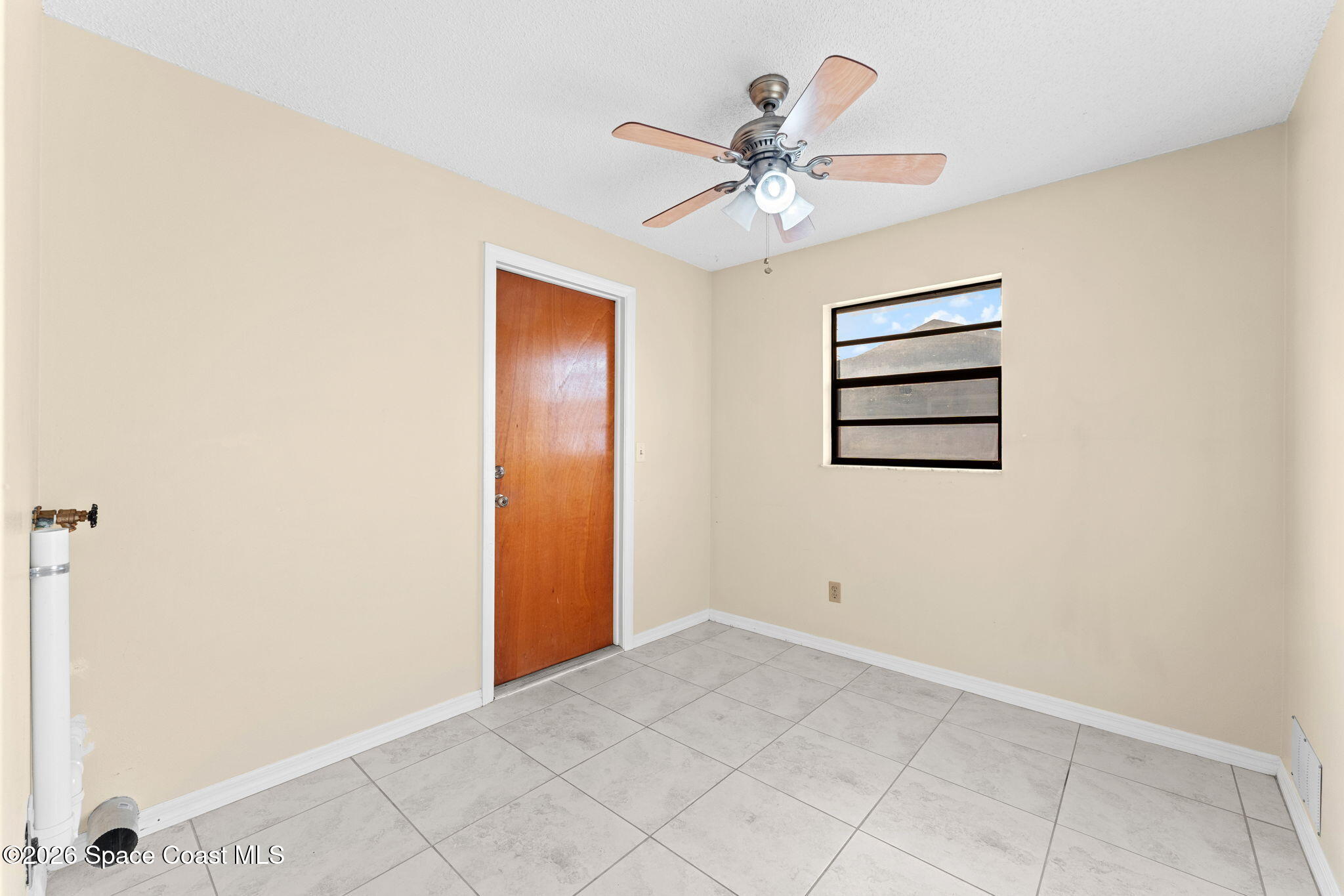 960 Pineland Drive Rockledge, FL 32955 - Photo 22 of 32 an empty room with closet and fan